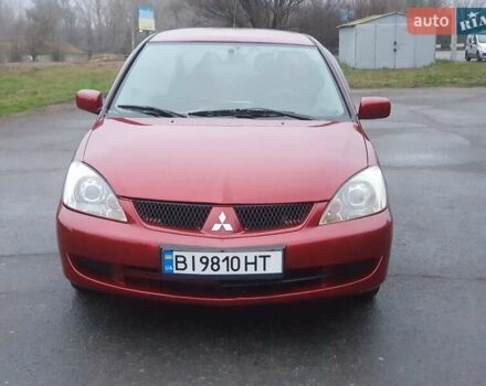 Красный Мицубиси Лансер, объемом двигателя 1.6 л и пробегом 250 тыс. км за 3700 $, фото 1 на Automoto.ua