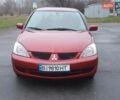 Красный Мицубиси Лансер, объемом двигателя 1.6 л и пробегом 250 тыс. км за 3700 $, фото 1 на Automoto.ua