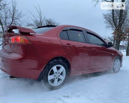 Червоний Міцубісі Lancer, об'ємом двигуна 2 л та пробігом 171 тис. км за 7500 $, фото 1 на Automoto.ua