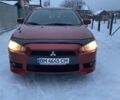 Червоний Міцубісі Lancer, об'ємом двигуна 2 л та пробігом 171 тис. км за 7050 $, фото 1 на Automoto.ua