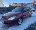 Красный Мицубиси Лансер, объемом двигателя 1.58 л и пробегом 250 тыс. км за 2950 $, фото 1 на Automoto.ua