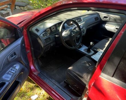 Красный Мицубиси Лансер, объемом двигателя 1.6 л и пробегом 344 тыс. км за 4000 $, фото 1 на Automoto.ua