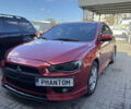 Червоний Міцубісі Lancer, об'ємом двигуна 2 л та пробігом 254 тис. км за 7500 $, фото 1 на Automoto.ua