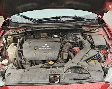Червоний Міцубісі Lancer, об'ємом двигуна 2 л та пробігом 186 тис. км за 5600 $, фото 26 на Automoto.ua