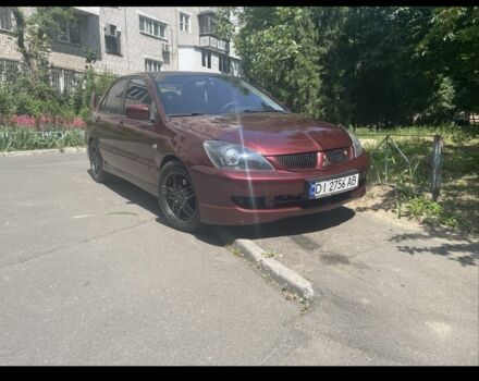 Красный Мицубиси Лансер, объемом двигателя 2 л и пробегом 3 тыс. км за 5800 $, фото 4 на Automoto.ua