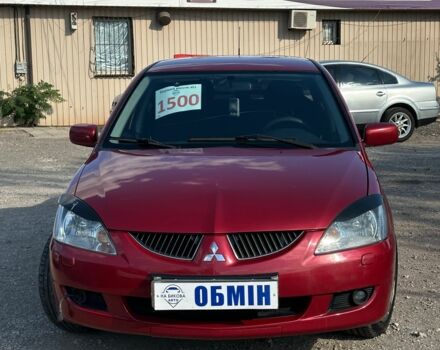 Красный Мицубиси Лансер, объемом двигателя 1.6 л и пробегом 230 тыс. км за 5300 $, фото 1 на Automoto.ua
