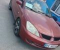 Красный Мицубиси Лансер, объемом двигателя 1.6 л и пробегом 270 тыс. км за 5141 $, фото 1 на Automoto.ua