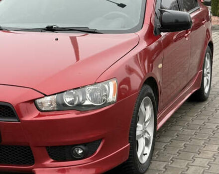 Красный Мицубиси Лансер, объемом двигателя 2 л и пробегом 261 тыс. км за 7200 $, фото 1 на Automoto.ua