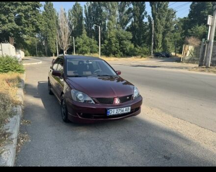 Красный Мицубиси Лансер, объемом двигателя 2 л и пробегом 3 тыс. км за 5800 $, фото 3 на Automoto.ua