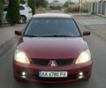 Червоний Міцубісі Lancer, об'ємом двигуна 1.6 л та пробігом 200 тис. км за 4010 $, фото 1 на Automoto.ua