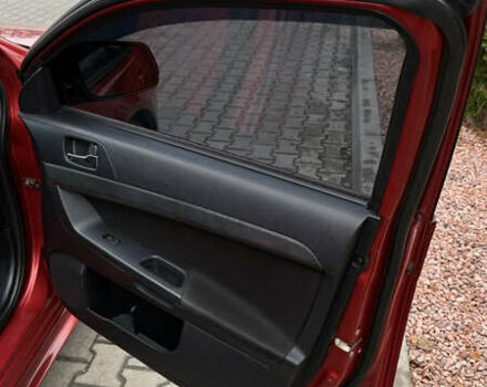 Красный Мицубиси Лансер, объемом двигателя 2 л и пробегом 261 тыс. км за 7200 $, фото 17 на Automoto.ua