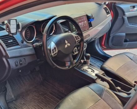 Красный Мицубиси Лансер, объемом двигателя 2 л и пробегом 274 тыс. км за 6000 $, фото 3 на Automoto.ua