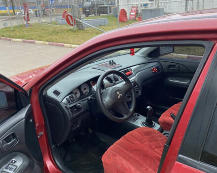 Червоний Міцубісі Lancer, об'ємом двигуна 1.58 л та пробігом 151 тис. км за 5600 $, фото 12 на Automoto.ua
