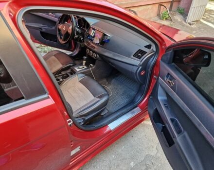 Красный Мицубиси Лансер, объемом двигателя 2 л и пробегом 274 тыс. км за 6000 $, фото 1 на Automoto.ua