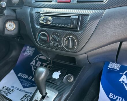 Красный Мицубиси Лансер, объемом двигателя 1.6 л и пробегом 230 тыс. км за 5300 $, фото 12 на Automoto.ua