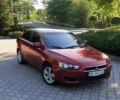 Червоний Міцубісі Lancer, об'ємом двигуна 2 л та пробігом 192 тис. км за 5999 $, фото 1 на Automoto.ua