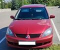 Червоний Міцубісі Lancer, об'ємом двигуна 2 л та пробігом 278 тис. км за 4000 $, фото 1 на Automoto.ua