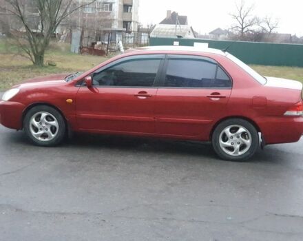 Красный Мицубиси Лансер, объемом двигателя 1.6 л и пробегом 250 тыс. км за 3700 $, фото 6 на Automoto.ua