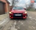 Красный Мицубиси Лансер, объемом двигателя 2 л и пробегом 66 тыс. км за 10000 $, фото 1 на Automoto.ua