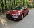 Красный Мицубиси Лансер, объемом двигателя 2 л и пробегом 165 тыс. км за 5700 $, фото 1 на Automoto.ua