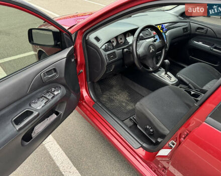 Красный Мицубиси Лансер, объемом двигателя 1.58 л и пробегом 285 тыс. км за 3650 $, фото 9 на Automoto.ua