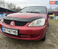 Красный Мицубиси Лансер, объемом двигателя 1.58 л и пробегом 280 тыс. км за 3250 $, фото 2 на Automoto.ua