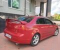 Червоний Міцубісі Lancer, об'ємом двигуна 2 л та пробігом 156 тис. км за 6999 $, фото 2 на Automoto.ua