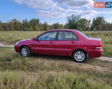 Красный Мицубиси Лансер, объемом двигателя 1.58 л и пробегом 264 тыс. км за 3900 $, фото 4 на Automoto.ua