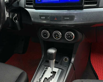 Красный Мицубиси Лансер, объемом двигателя 2 л и пробегом 261 тыс. км за 7200 $, фото 12 на Automoto.ua