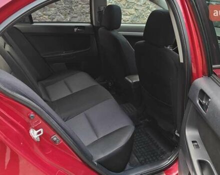 Червоний Міцубісі Lancer, об'ємом двигуна 2 л та пробігом 187 тис. км за 5500 $, фото 27 на Automoto.ua