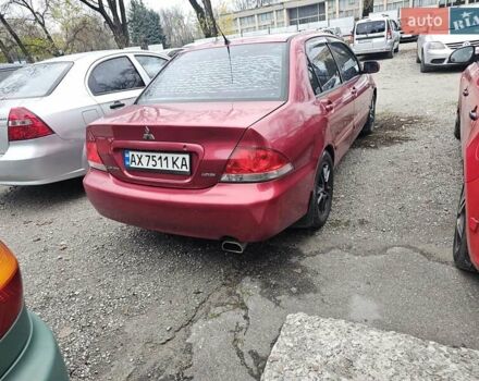Червоний Міцубісі Lancer, об'ємом двигуна 1.6 л та пробігом 267 тис. км за 2999 $, фото 4 на Automoto.ua