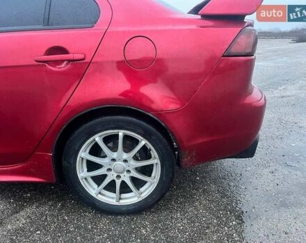 Красный Мицубиси Лансер, объемом двигателя 1.5 л и пробегом 241 тыс. км за 5850 $, фото 7 на Automoto.ua