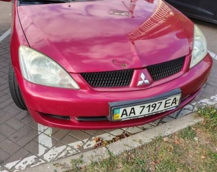 Красный Мицубиси Лансер, объемом двигателя 1.58 л и пробегом 264 тыс. км за 3900 $, фото 1 на Automoto.ua