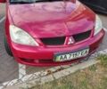 Красный Мицубиси Лансер, объемом двигателя 1.58 л и пробегом 264 тыс. км за 3900 $, фото 1 на Automoto.ua