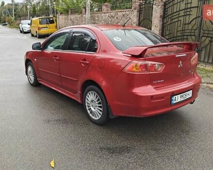 Червоний Міцубісі Lancer, об'ємом двигуна 2 л та пробігом 187 тис. км за 5600 $, фото 9 на Automoto.ua