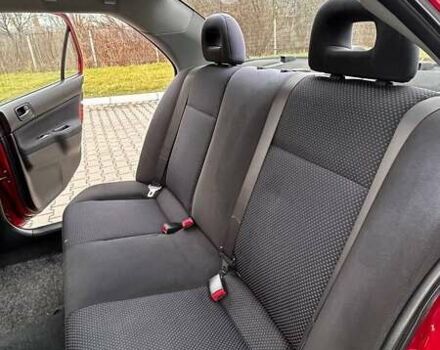 Красный Мицубиси Лансер, объемом двигателя 1.6 л и пробегом 176 тыс. км за 4300 $, фото 13 на Automoto.ua