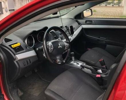 Красный Мицубиси Лансер, объемом двигателя 2 л и пробегом 198 тыс. км за 5700 $, фото 3 на Automoto.ua