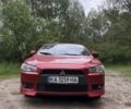 Красный Мицубиси Лансер, объемом двигателя 2 л и пробегом 174 тыс. км за 6204 $, фото 1 на Automoto.ua