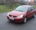 Красный Мицубиси Лансер, объемом двигателя 1.6 л и пробегом 250 тыс. км за 3700 $, фото 1 на Automoto.ua