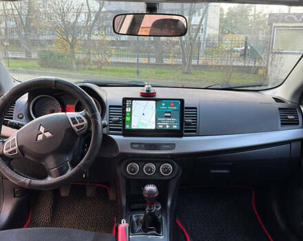 Красный Мицубиси Лансер, объемом двигателя 2 л и пробегом 143 тыс. км за 5200 $, фото 21 на Automoto.ua