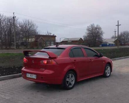 Красный Мицубиси Лансер, объемом двигателя 2 л и пробегом 200 тыс. км за 6000 $, фото 5 на Automoto.ua