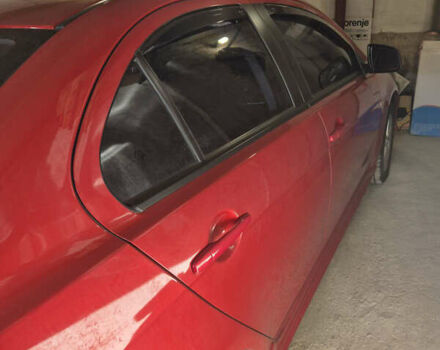 Красный Мицубиси Лансер, объемом двигателя 2 л и пробегом 65 тыс. км за 9300 $, фото 4 на Automoto.ua