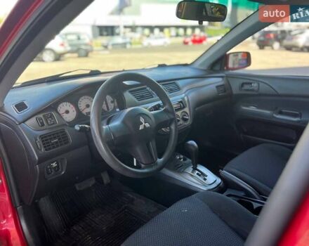 Червоний Міцубісі Lancer, об'ємом двигуна 1.58 л та пробігом 223 тис. км за 6400 $, фото 19 на Automoto.ua