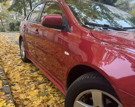 Червоний Міцубісі Lancer, об'ємом двигуна 2 л та пробігом 203 тис. км за 8000 $, фото 10 на Automoto.ua