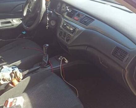 Мицубиси Лансер 2008 в Львове на Automoto.ua Красный Мицубиси Лансер, объемом двигателя 1.58 л и пробегом 280 тыс. км за 3200 $, фото 20 на Automoto.ua