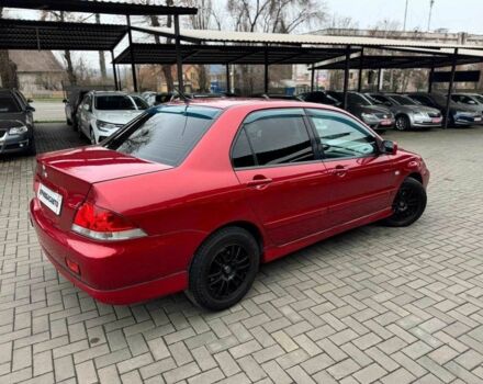 Красный Мицубиси Лансер, объемом двигателя 1.6 л и пробегом 215 тыс. км за 4500 $, фото 9 на Automoto.ua