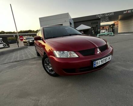 Червоний Міцубісі Lancer, об'ємом двигуна 1.6 л та пробігом 257 тис. км за 4600 $, фото 4 на Automoto.ua