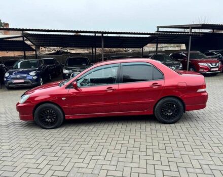 Красный Мицубиси Лансер, объемом двигателя 1.6 л и пробегом 215 тыс. км за 4500 $, фото 5 на Automoto.ua