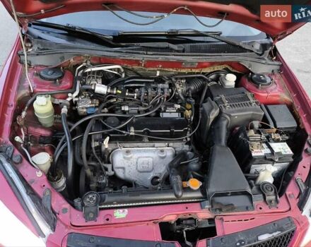 Червоний Міцубісі Lancer, об'ємом двигуна 1.58 л та пробігом 140 тис. км за 6000 $, фото 27 на Automoto.ua