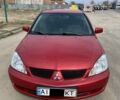 Червоний Міцубісі Lancer, об'ємом двигуна 1.6 л та пробігом 330 тис. км за 4100 $, фото 1 на Automoto.ua
